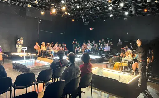 Educators and audience members gather for a Washington, D.C. performance of "The BOX." Image by Mikaela Schmitt. United States, 2022.