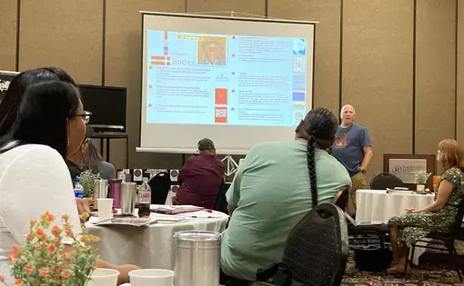 Teachers from across the state listen to Dan Snyder, one of the original OSEU writers, present at the Wóokiye Teacher Conference on ways to incorporate Oceti Sakowin culture into their lessons.