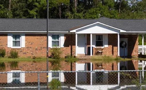 Flood waters backing up on a bridge just south of Raeford, North Carolina, after Hurricane Florence. United States, 2018.