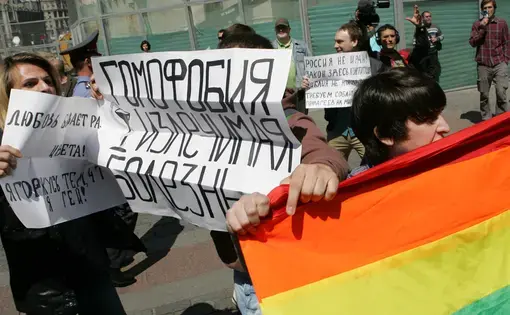 Gay rights activists take part in the unauthorized gay pride parade in central Moscow, Russia on May 28, 2011. The banner in center reads "Homophobia can be cured." Image courtesy of Shutterstock. Russia, 2011.
