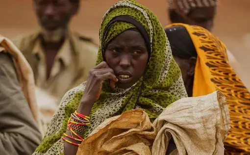 A woman attends a food distribution event in Kenya