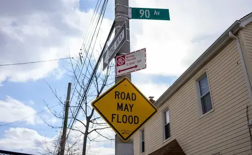 A yellow sign warning of flooding