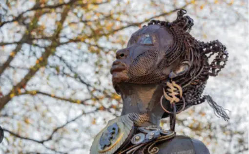Closeup image of part of the Mothers of Gynecology Monument memorializing Lucy, Betsey, and Anarcha.