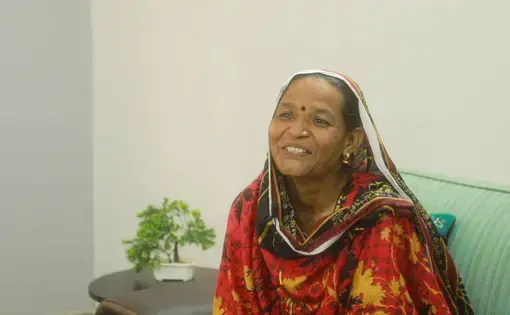 An older woman smiles