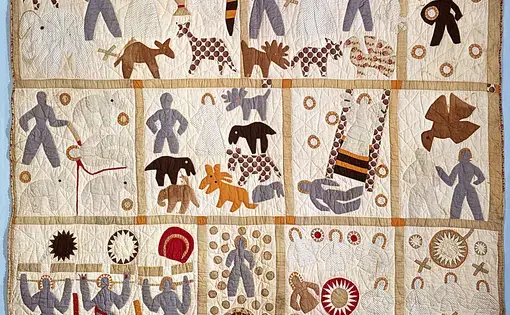 A quilt by Harriet Powers with quadrants that together depict a story