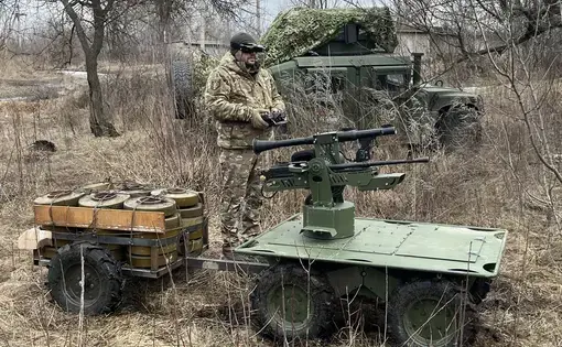 A Ukrainian soldier uses a remote control