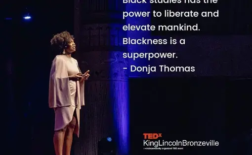 Image of woman standing on a stage with a quote in white text on top