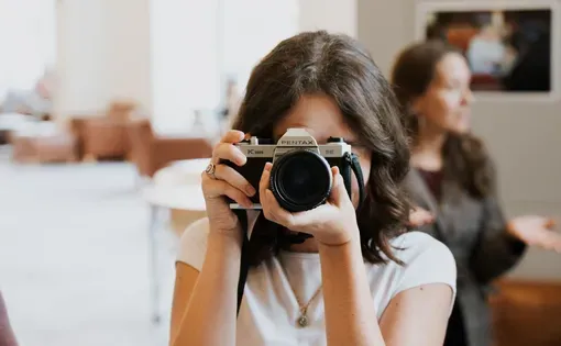 A person holding a camera
