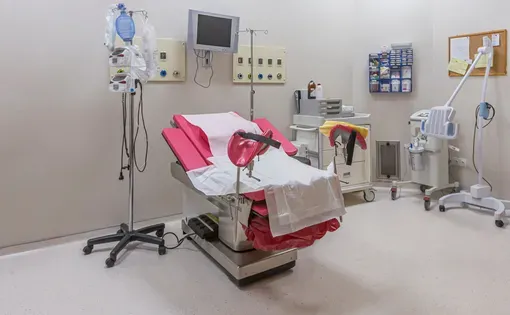 Chair for inspection of pregnant women in gynecology clinic. Image by Mehmet Cetin/Shutterstock.