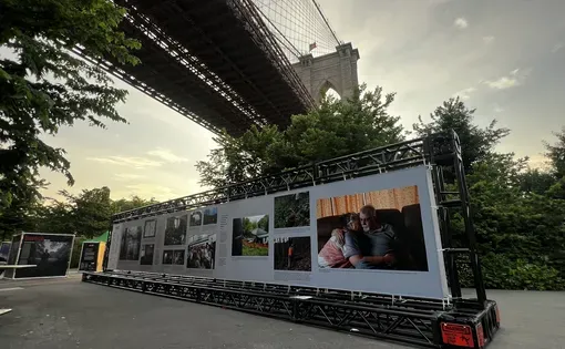 Banner with photos under the Brooklyn Bridge at sunset