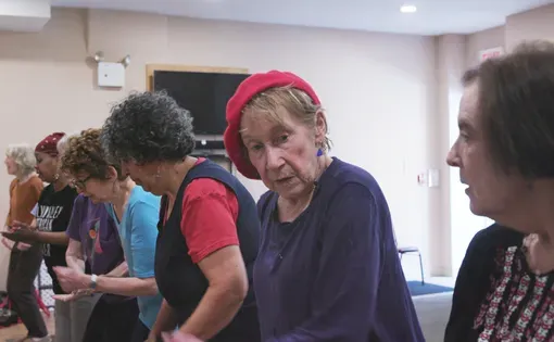 Chris O’Sullivan attends a dance class at the Washington Square Park Senior Center in New York, May 2025. Image by Nicola Sitch and Claudia Rosel. United States, 2025.