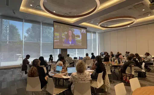 Ashonti Ford's presentation is projected to a room of teachers