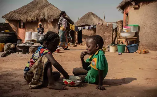 Children in Alimatu Alidu’s household, shown here, enjoy a dish made from cowpea. Image by Ankur Paliwal. Ghana, 2019.