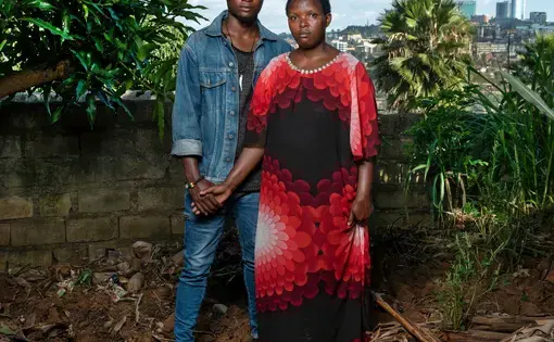 Josette, 40, and her son Thomas, 24: Josette was beaten and raped by militiamen. After the genocide, a pregnant Josette was rejected by members of her family. Thomas is now training to be a plumber. Image by Jonathan Torgovnik. Rwanda, 2018.