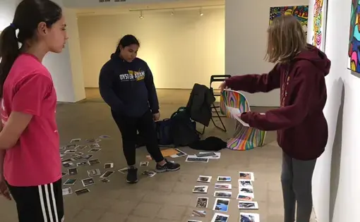 DC students curate the 2017 Everyday DC photography exhibition. Image by Evey Wilson. United States, 2017.