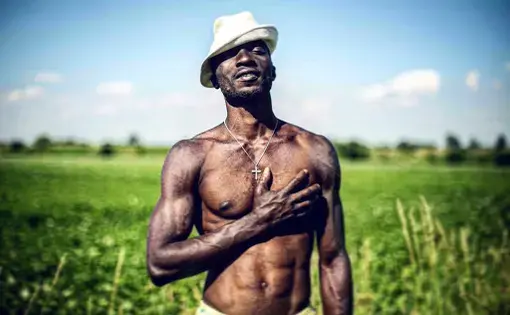 Israel, a 30-year-old Nigerian refugee poses for a portrait in the countryside of Bavaria, Germany. Image by Angèlica Ekeke. Germany, 2019.