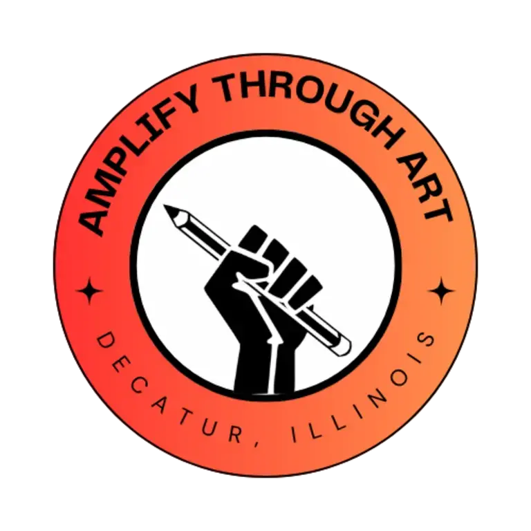 Amplify Through Art Logo - black fist holding a pencil framed by an orange gradient circle with the text "Amplify Through Art, Decatur, Illinois"