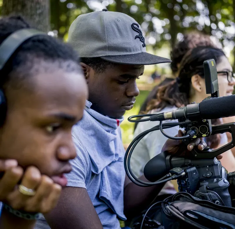 two students look through two cameras
