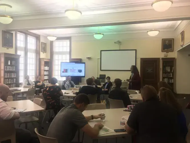 Rebecca McKnight, Director of Social Studies for Winston-Salem/Forsyth County Schools, facilitates a guided exploration of images from The 1619 Project as part of a professional development workshop for teachers. Image by Fareed Mostoufi. United States, 2019.