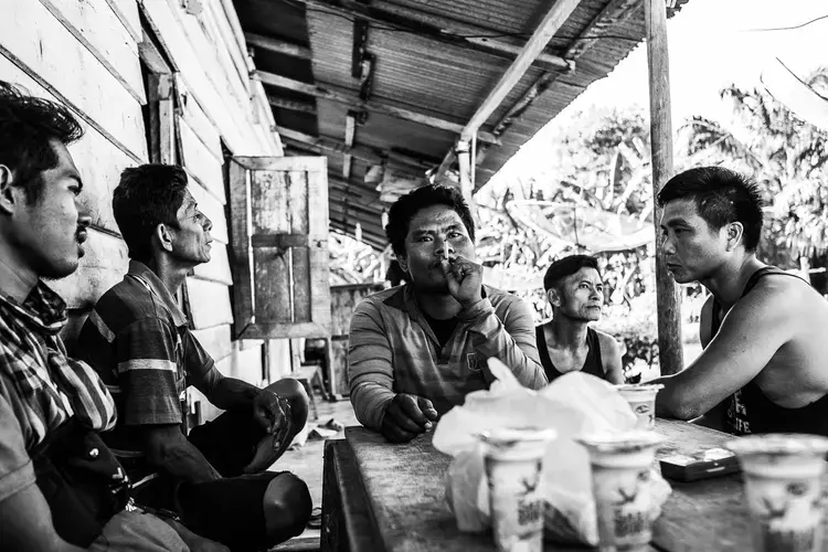 MEETING. Palm oil workers meet to discuss their work conditions in the plantation. Image by Xyza Cruz Bacani. Indonesia, 2018.&nbsp;