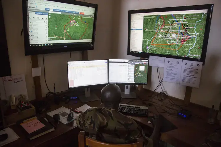 Inside the park’s control room, where software plots ranger movement, bush fires&nbsp;and other crucial information on a Google Earth map. Image by Jack Losh. Central African Republic, 2018.