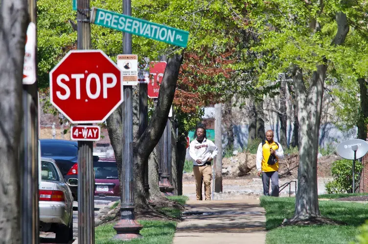 The Preservation Square neighborhood is located in the middle of the 63106 ZIP code and includes a public elementary school, an early childhood center and a convenience store, and is accessible to Metro bus routes. Nearly half the residents in 63106 do not own vehicles, and half have incomes below the poverty line. Image by Wiley Price / St. Louis American. United States, 2020.