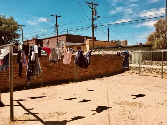 A clothesline behind Casa Vides. Because of the “Remain in Mexico” policy, Casa Vides isn’t as full as usual, but the shelter continues to receive a steady trickle of migrants.&nbsp;Image by Lily Moore-Eissenberg. United States, 2019.