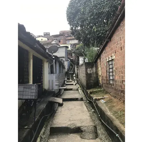 Outside of the&nbsp;USF, a Family Health Unit&nbsp;in Córrego do Eucalipto, stairs wind up into hillsides packed with homes.&nbsp;Some&nbsp;people refer to this area as a favela, or urban slum, while others prefer the term 'periphery region'.&nbsp;Image by Poonam Daryani. Brazil, 2017.