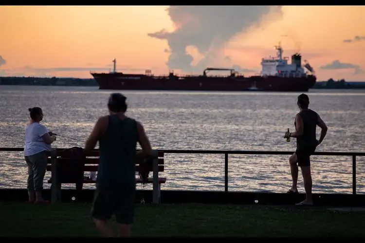 Near the eastern end of Lake Ontario, a freighter travels the St. Lawrence River at Cape Vincent, New York, on July 30, 2020. Image by Zbigniew Bzdak/Chicago Tribune. United States, 2020.<br />
