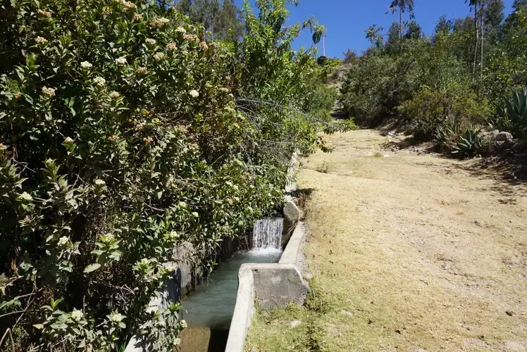 One of the canals that delivers water to nearby communities. Water is intended to flow to the top of the cement walls.&nbsp;Image by Audrey Fromson. Peru, 2019.
