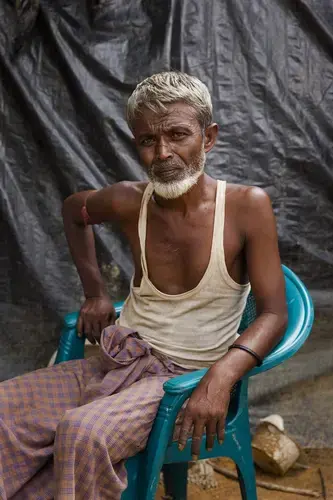 Dudu Mia, a Rohingya rice farmer, fled Myanmar after Buddhist vigilantes issued an ultimatum in his village: Leave or die. Image by Patrick Brown. Bangladesh, 2017.