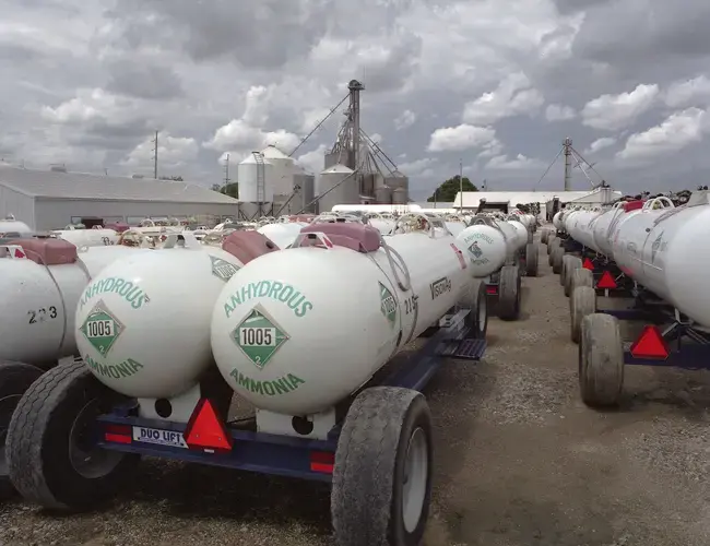 Keota, Iowa - Fertilizer trucks parked at Vision Agriculture. Alongside the Hypoxia Task Force’s promise to shrink the dead zone by 20 percent, Iowa’s Nutrient Reduction Strategy have also promised to make a 45 percent decrease in fertilizer runoff.&nbsp;Image by Spike Johnson. United States, 2019.