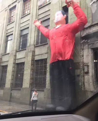 Inflatable figure of Hugo Chávez outside a building in the city's&nbsp;downtown area. Image by Fernando Gago. Venezuela, 2017.