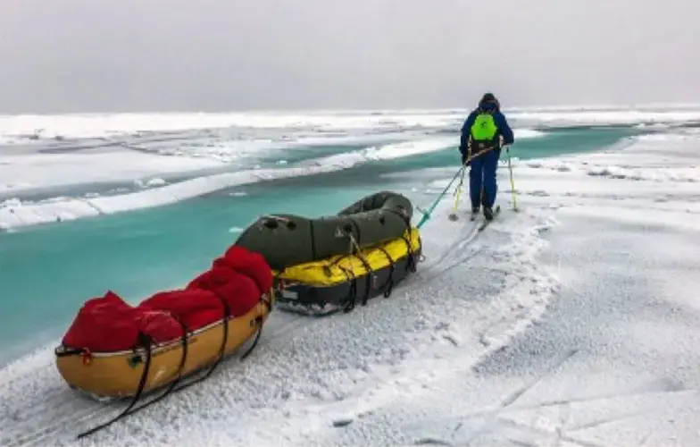 The warming that has caused permafrost to thaw also has reduced the extent and thickness of Arctic sea ice. Explorers Mike Horn and Borge Ousland, who is show here, encountered open water and as they made an epic trek this fall to the North Pole and south toward Norway. Image courtesy of Mike Horn. United States, 2019.