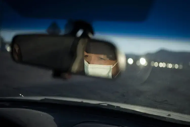 Norma Flores drives to a grocery store near her home in Henderson, Nev., Tuesday, Nov. 10, 2020. Image by Wong Maye-E / AP Photo. United States, 2020.