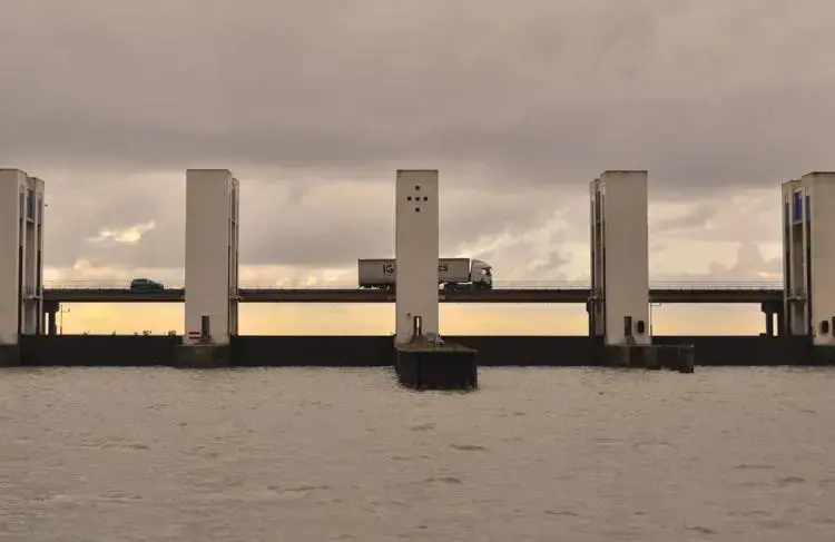 Vehicles pass over a series of locks that regulate the flow of water between Marker Lake and a large bay north of Amsterdam.&nbsp;Image by Tristan Baurick / Times-Picayune | The Advocate. The Netherlands, 2020.