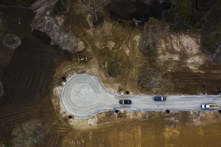 Machinery clears land to make way for new homes in a subdivision off Bees Ferry Road in West Ashley on Friday, Dec. 4, 2020. Image by Lauren Petracca/The Post and Courier&nbsp;Staff. United States, 2020.<br />
