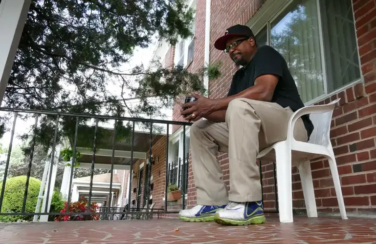 Cecil Burton says he had long feared he would die with child support debt. The 54-year-old West Baltimore man is in deep debt from years when he was struggling with a heroin addiction. He got clean in 1999, and has tried since then to pay what he owes. The system, meanwhile, has rescinded his right to drive, seized his tax refunds and threatened to put him in prison. Image by Lloyd Fox / Baltimore Sun. United States, undated. 