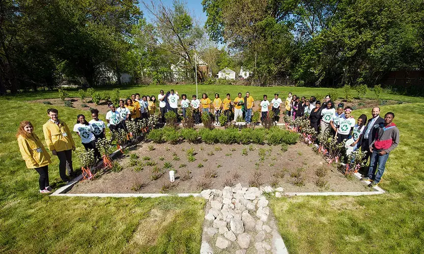 Community leaders, project partners and local residents celebrate the installation of a bioretention garden on a vacant lot in Detroit in May 2016. All together, four such gardens were expected to cut stormwater flow by 1.2 million gallons per year, reducing street flooding and water pollution. Image by University of Michigan School for Environment and Sustainability / Flickr. United States, 2020.&nbsp;