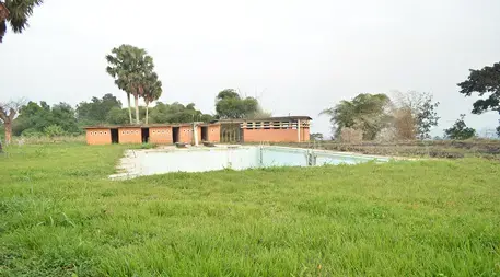 The pool at Yangambi sits empty, like many of the buildings at the site. Image by Daniel Grossman. Democratic Republic of the Congo, 2017.