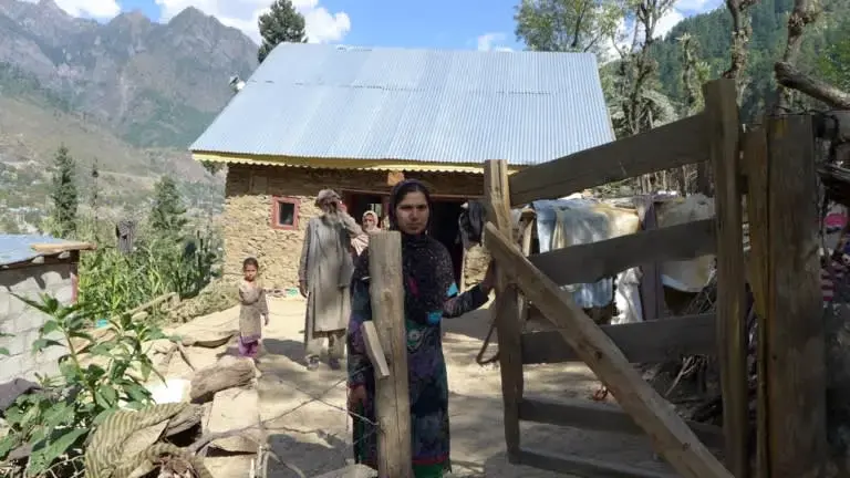 Rubela Bano, 27, says that traveling to the hospital was the toughest part of her three pregnancies. For most women in her village, the only way to the maternity ward is on a man's shoulders.&nbsp;Image&nbsp;by Safina Nabi. India, 2020.