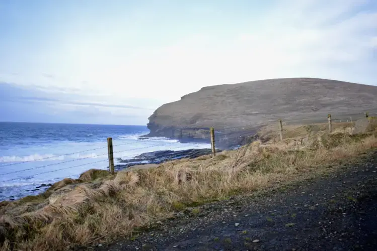 The European Marine Energy Center has two test sites, one for wave energy and one for tidal energy. The wave energy test facility and substation is located in Billia Croo, just outside of Stromness. Undersea cables stretch out under the waves to sites in the ocean, where developers can test their green energy technology before commercialization. Image by Maggie More. United Kingdom, 2020.
