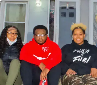 From left, Maleah, Jacobi and Misha outside their home in Columbus Square. Image by Wiley Price/the St. Louis Jewish Light.