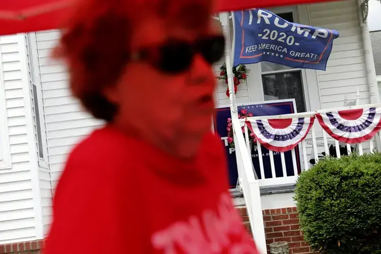 Doris Miller, 86, tends to her makeshift store selling Trump souvenirs in front of her home in Vienna, Ill. Image by Wong Maye-E/AP Photo. United States, 2020.