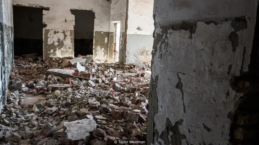 A former fish canning factory in Moynaq, previously a thriving fishing hub, has fallen into ruin. Image by Taylor Weidman. Uzbekistan, 2018. 