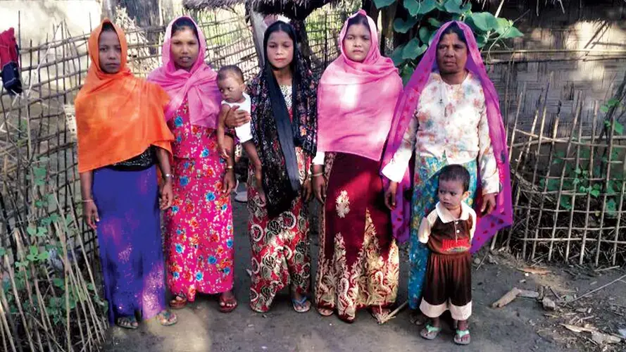 Rajuma (center) holding her infant son, Sadiq, five months before the attack on Tula Toli last August. Image courtesy of Mohammad Rafiq. Myanmar, 2017.