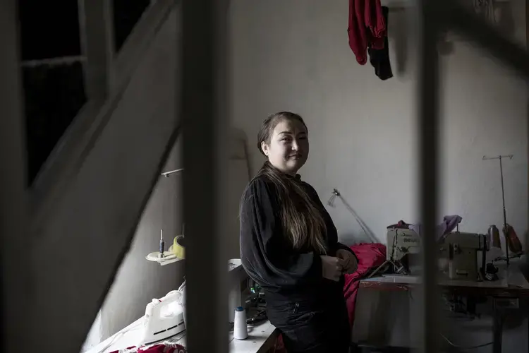 Dina Nurdybai in her sewing workshop at her home in Almaty, Kazakhstan, on February 25, 2020. Ekaterina Anchevskaya/BuzzFeed News. Kazakhstan, 2020.