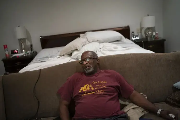 Mike Bishop sits in his bedroom. Image by Wong Maye-E/AP Photo. United States, 2020.