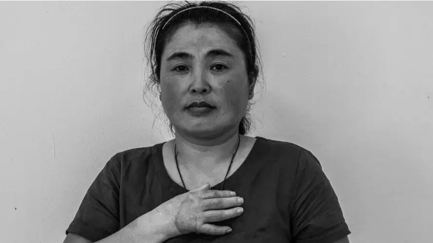 Noodle factory Xi Feng from China had&nbsp;only been in Singapore for 25 days when she was injured at work. The agency responsible for her refused to pay her back, she said. Image by Xyza Bacani. Singapore, 2017.