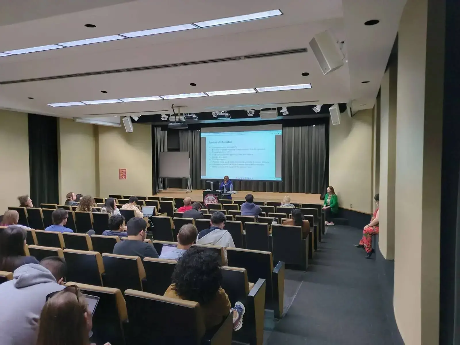 A half-full auditorium.
